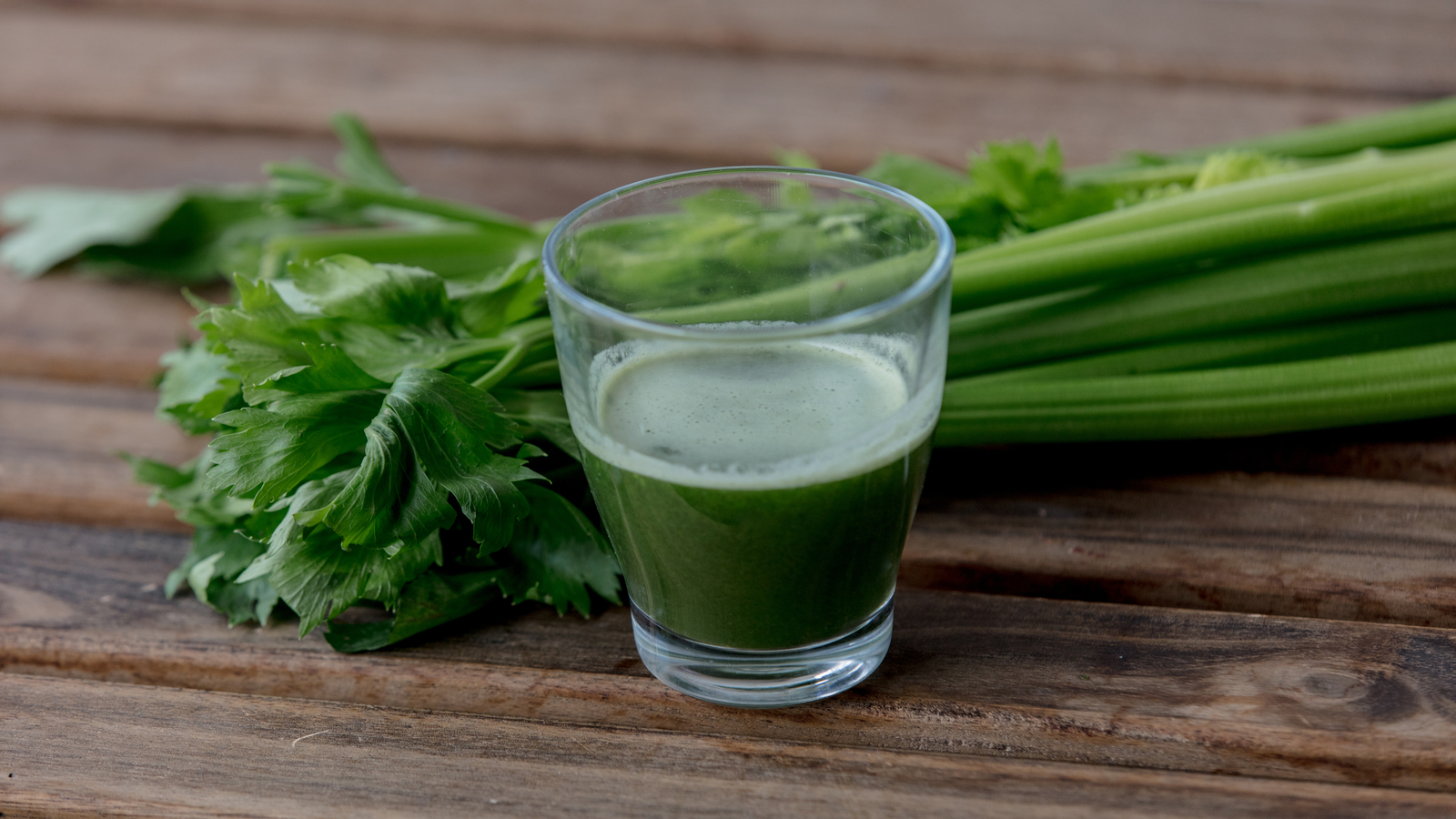 glass of celery juice on a table