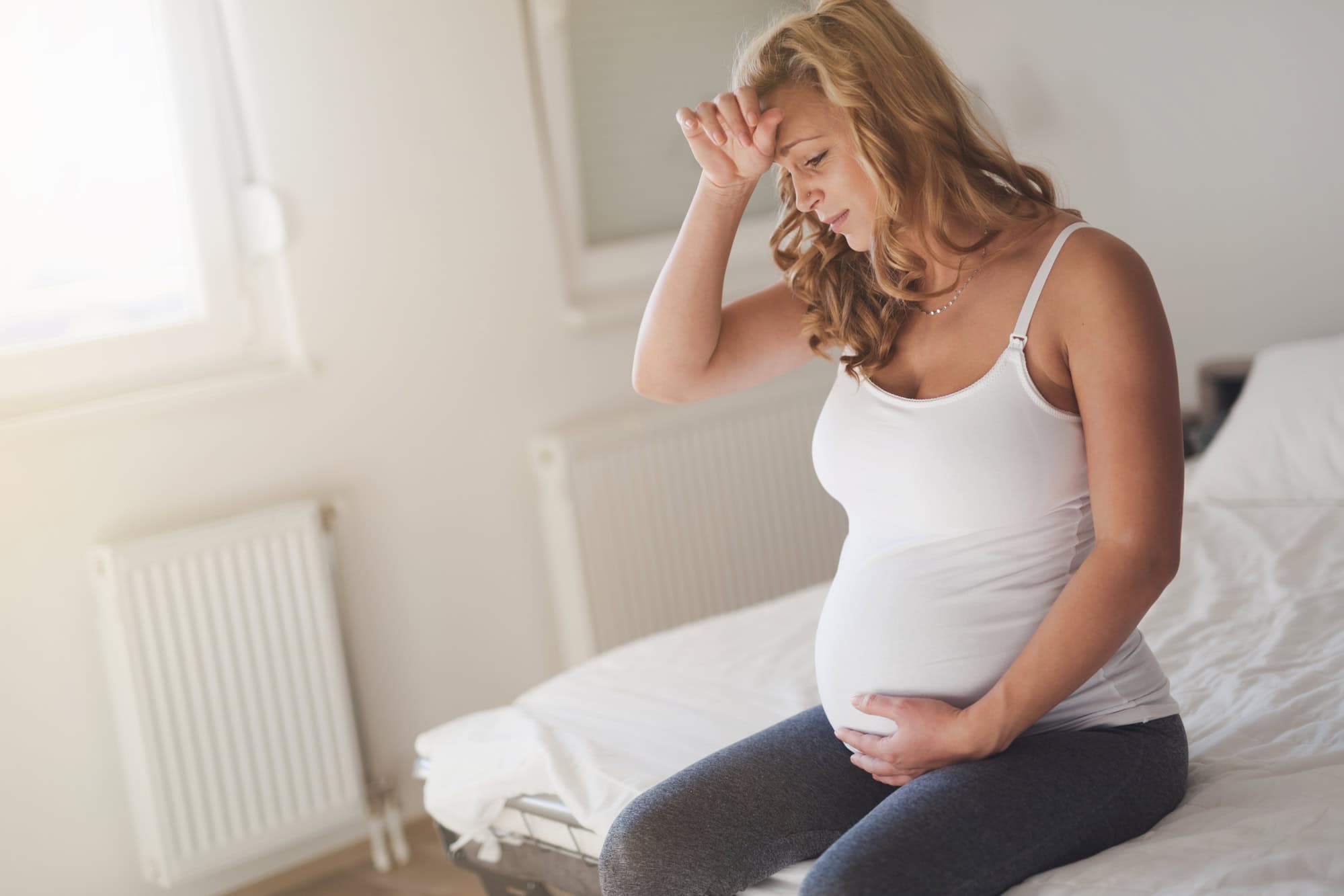 woman in late pregnancy experiencing stress