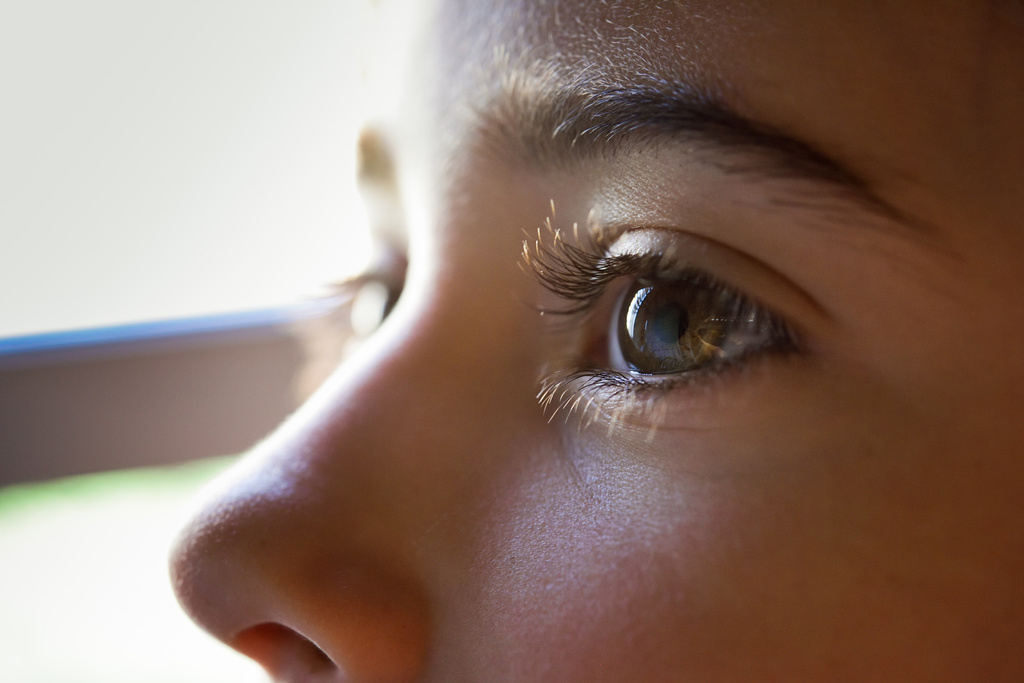 stock photo close up of beautiful little girl brown eyes