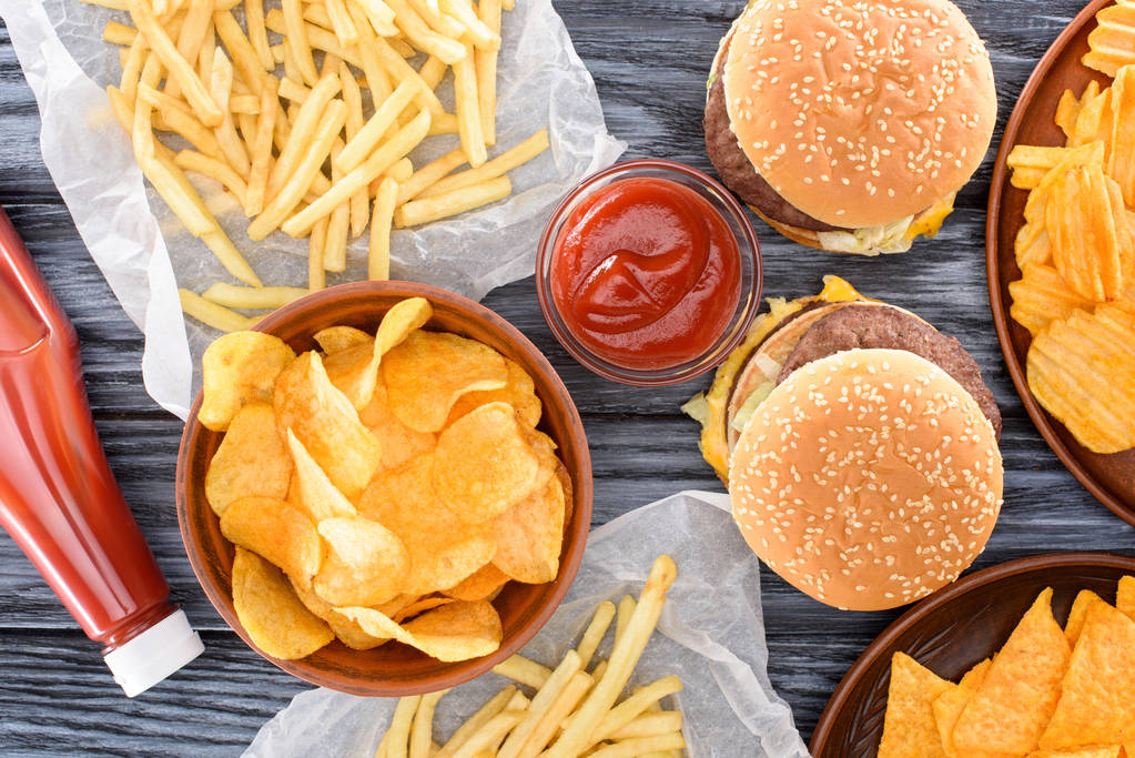 stock photo top view assorted junk food wooden table