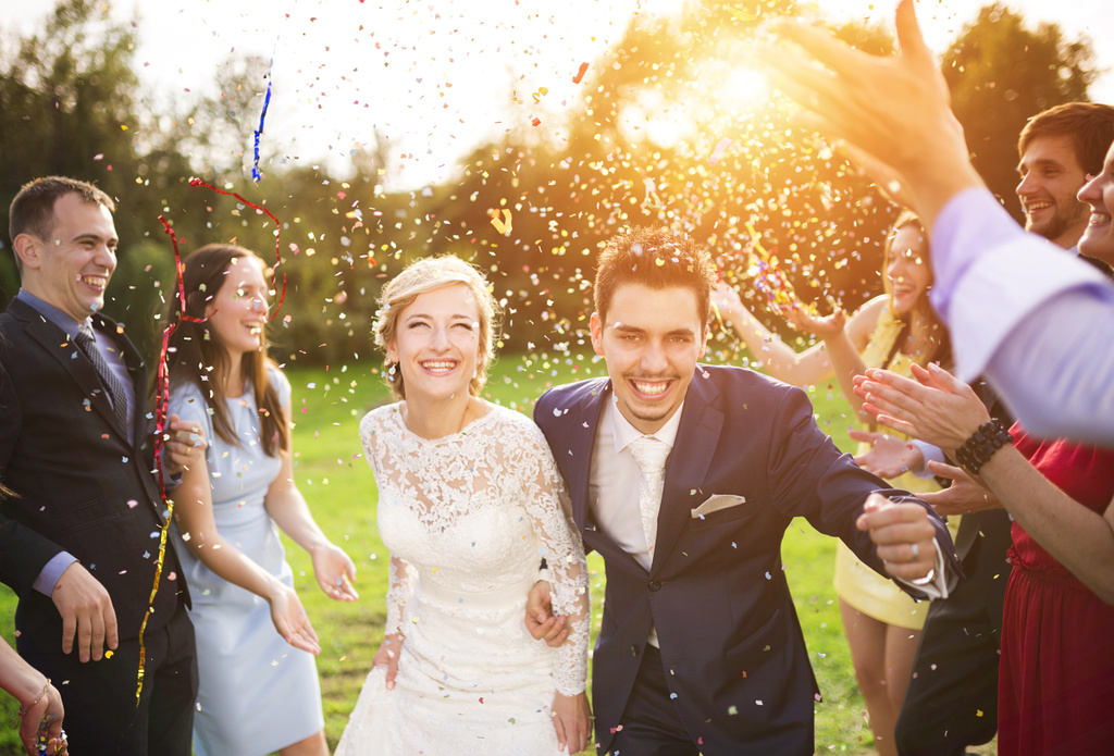 stock photo newlywed couple and their friends