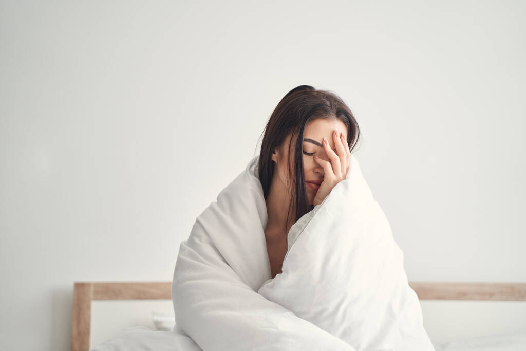 stock photo young woman suffering from headache caused by stress